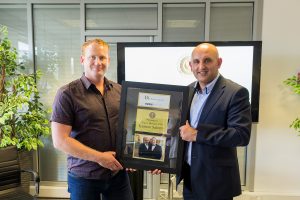 Adam Stott helps automotive boss Kamran Saleem